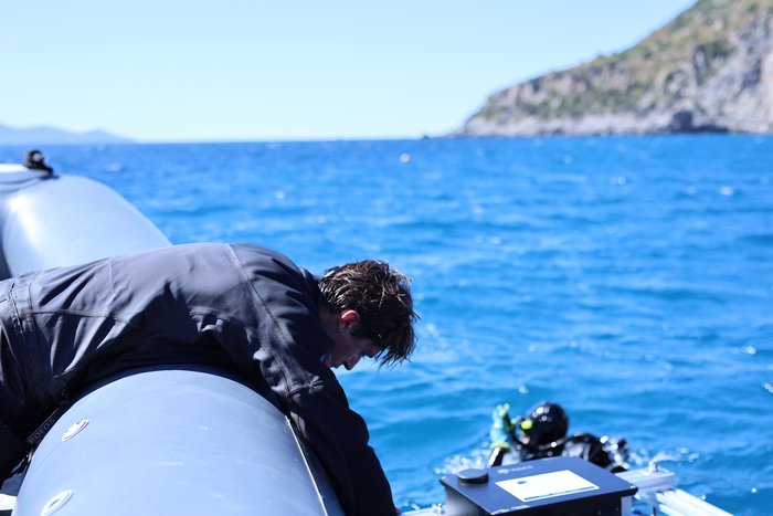 Diver in the water installing the WAILS scientific buoy at Argentario